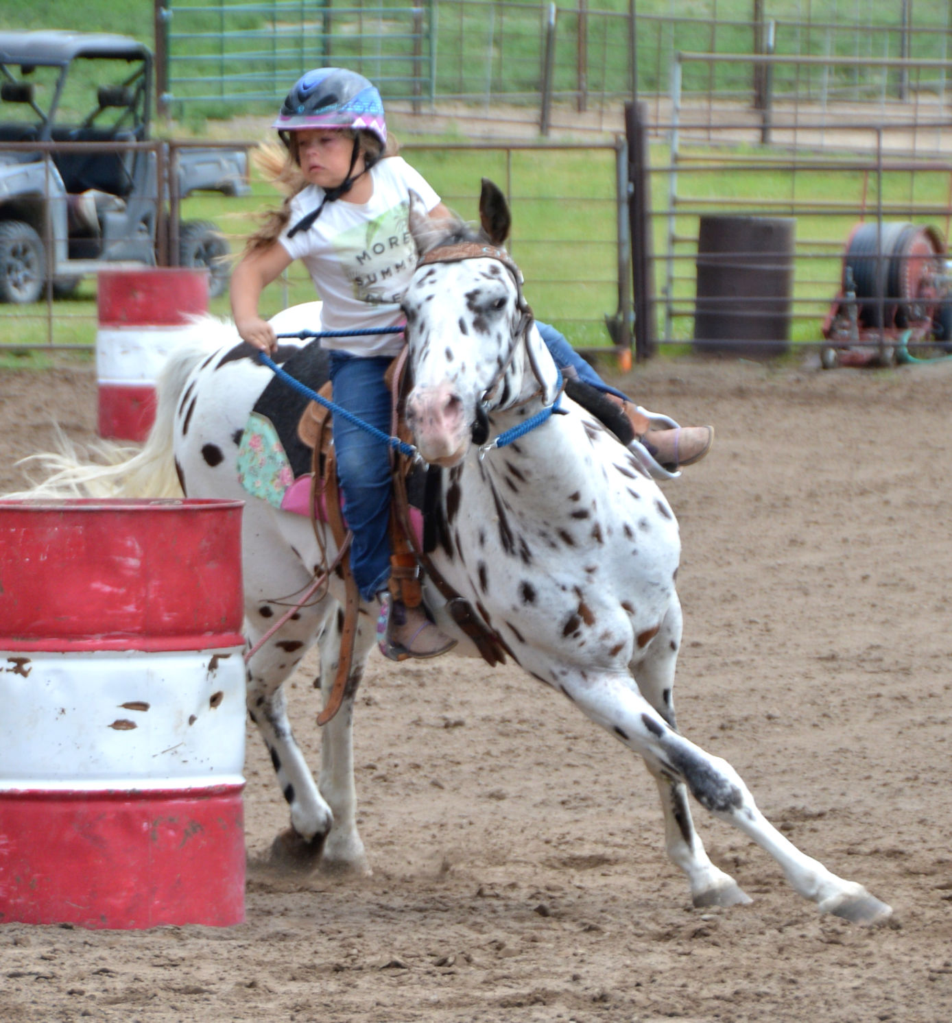 Prairie Somes and Tilly take a turn in barrel racing